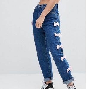 ASOS high waisted blue jeans with pink bow details